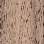 Close-up of a wood grain texture in brown tones with visible vertical lines and subtle color variation.